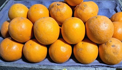  Ripe Orange Fruits in a Fruit Stall