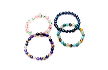Four different bracelets close-up on white background