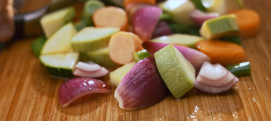 Chef chopping fresh vegetables on a cutting board