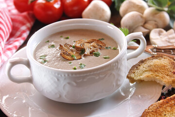 Creamy mushroom soup in ceramic bowl
