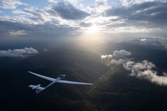 White glider soaring above a mountain range, Early morning light breaking through clouds, Serene and expansive aerial scene - Powered by Adobe