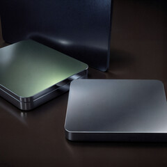 Sleek Metallic Squares with Brushed Finish on a Dark Background