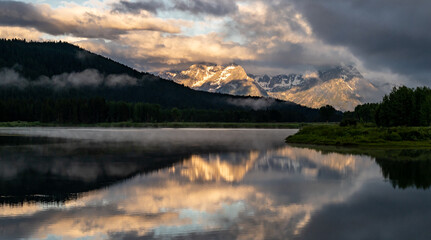 Faint Fog Hangs Over The Snake River At Oxbow Bend