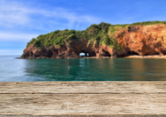 Wooden table top on the beach or sea.Party on the beach  sunshine time concept.For montage product display or design key visual layout.View of copy space.