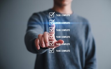 Person touching digital checklist with completed tasks finger screen