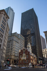 Fototapeta premium Old State House Surrounded by Skyscrapers on a Winter Day in Downtown Boston