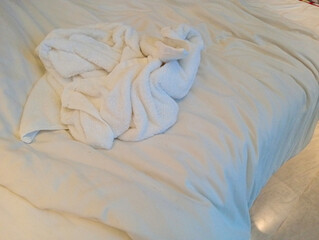 White towel used the bed in the hotel room.
