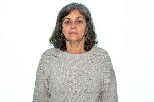 Passport-Style Studio Portrait of Serious Grey-Haired Woman with Light Eyes