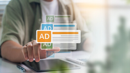 online marketing and promotional campaign concept. businessman touching virtual ads on screen using tablet at home office, marketing technology for commercial campaigns and brand promotion