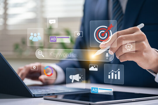 Search marketing and keywords optimization concept with businessman using stylus on digital interface showing SEO, targeting, and advertising icons for AI online campaign and data driven visibility