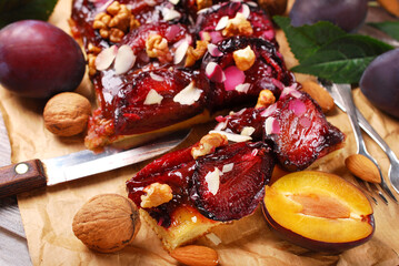 Closeup of homemade plum cake and fresh fruits