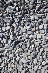  High-resolution texture of gray crushed stones. Natural stone gravel background, perfect for construction, design, landscaping, or industrial themes. Neutral, rough and realistic. High quality photo
