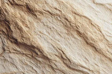 Close-up of a textured, light beige and tan stone surface, showcasing flowing, undulating lines and subtle variations in tone