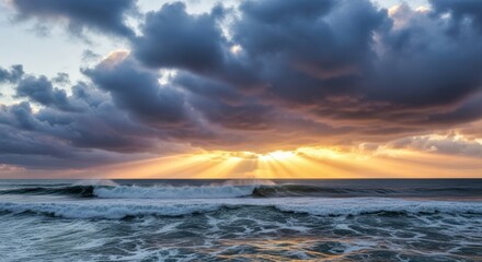 Fototapeta premium Dramatic Sunset Over Ocean Waves with God Rays