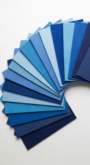 blue colored felt sheets fanned out on a solid white background