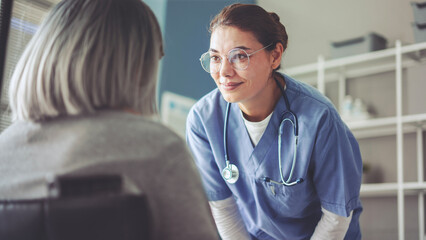 Healthy lifestyle and medical concept, the healthcare worker talks to the elderly patient and comforts her