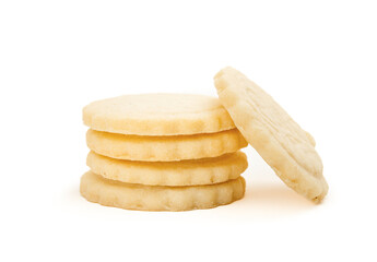 Butter cookie tower. Isolated yellow cookies or biscuits. Multiple French cookies also known as  Parisian butter cookies, soleils or sablés. Tea biscuit or for holiday gifting. Selective focus.