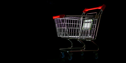 The illuminated shopping cart glowing against a dark minimalistic backdrop