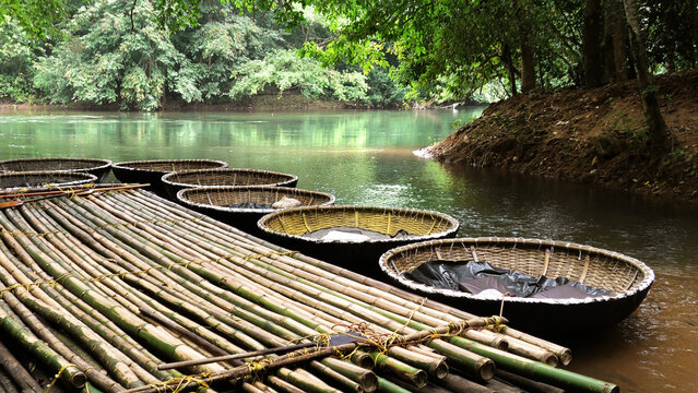 Coracle boats moored on the banks of Kallar river at Adavi, Pathanamthitta, Kerala, India | Adavi Eco Tourism