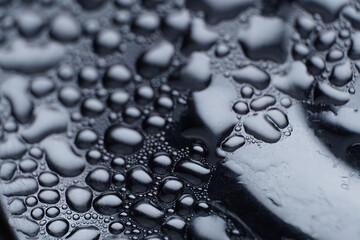 abstract water drops on polished stainless steel surface 