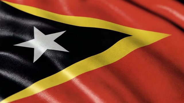 Waving East Timor flag with detailed texture, symbolizing national pride and movement in a dynamic visual representation.