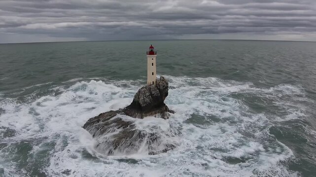 cinematic vertical footage social platforms captures strong waves crashing rocks lighthouse stormy coastal day aly providing dramatic sea motion powerful sense video