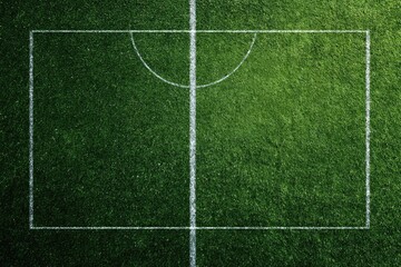 High-angle view of a soccer field, showing the center circle and boundary lines.  Green grass field with white lines