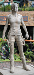Statue of lara croft from tomb raider. Stone sculpture of famous video game character hero and movie film icon © Preethiloki