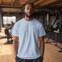 Fototapeta premium Male sportsman wearing a loose blue t-shirt for a mockup design