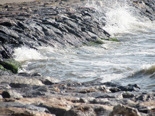 Small boats docked peacefully by the lakeside, reflecting calm water and serene natural landscape.