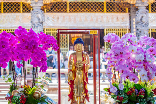 Taipei Taiwan 31st May 2025: In front of the main hall at Lungshan Temple in Taipei&rsquo;s Wanhua District (Monga), a small Buddha statue is enshrined with offerings.