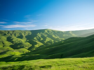 Lush green hills under a vibrant blue sky