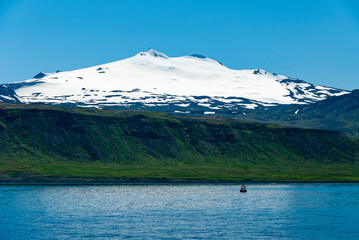Snaefellsjökull is a 700,000 year old volcano covered by a glacier from the last ice age. It is...