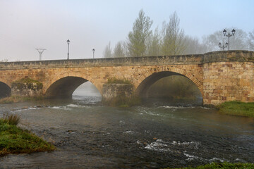 Fototapeta premium Romanesque bridge over the Pisuerga River in Aguilar de Campoo