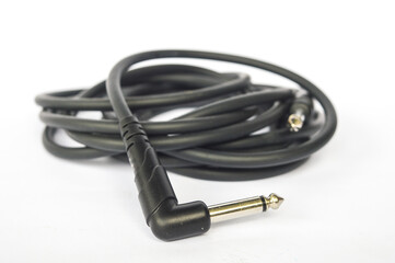 Guitar audio jack with black cable isolated on white background