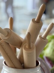 Rustic Rolling Pins in a Ceramic Jar