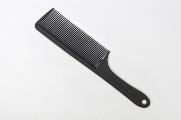 black comb of carbon material isolated on white background