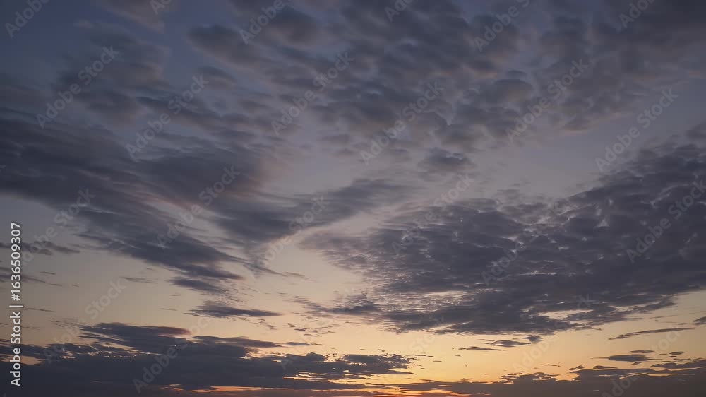Wall mural the sky gradually lightens just dawn mesmerizing time lapse showing cirrostratus clouds glowing soft