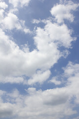 
Blue sky and puffy clouds.