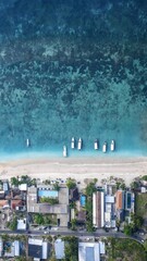 Obraz premium Tropical oasis in Indonesia showcases vibrant blue ocean waves with serene coastal charm and exotic island beauty
