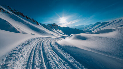 Bicycle tracks in untouched snow on a sunny winter mountain, crisp white landscape, clear blue sky, high-resolution, professional photo style.
