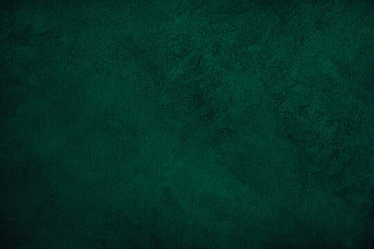 Black dark green blue emerald teal viridian texture background. Painted concrete wall surface. Grunge rough uneven plaster scratched damaged. Close-up. Design. Template. Blank.