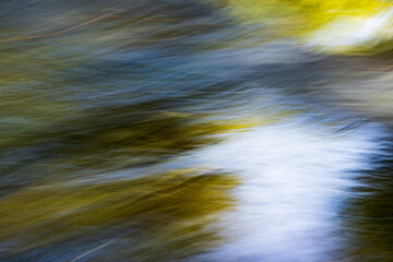 Abstract movement on the surface of river water in the sun