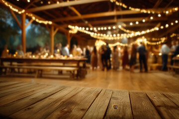 Empty rustic wooden table with blurred indoor wedding reception and string lights, warm romantic atmosphere for celebration themes