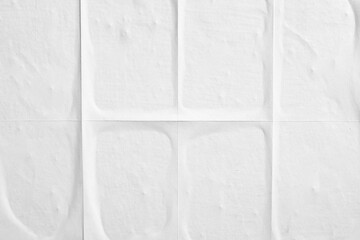 Close-up texture of white paper with folds.