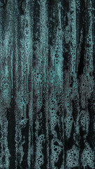 Cyan-colored laundry detergent on a laundry board, close-up shot, abstract background
