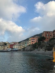 Distant mountains above the sparkling blue sea.

