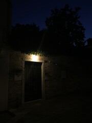 Peaceful waterway in Venice at night.
