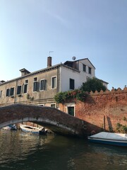 Close-up of weathered Venetian architecture on the water.

