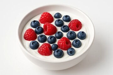 A delightful bowl of yogurt adorned with fresh raspberries and blueberries, offering a sweet and nutritious breakfast option